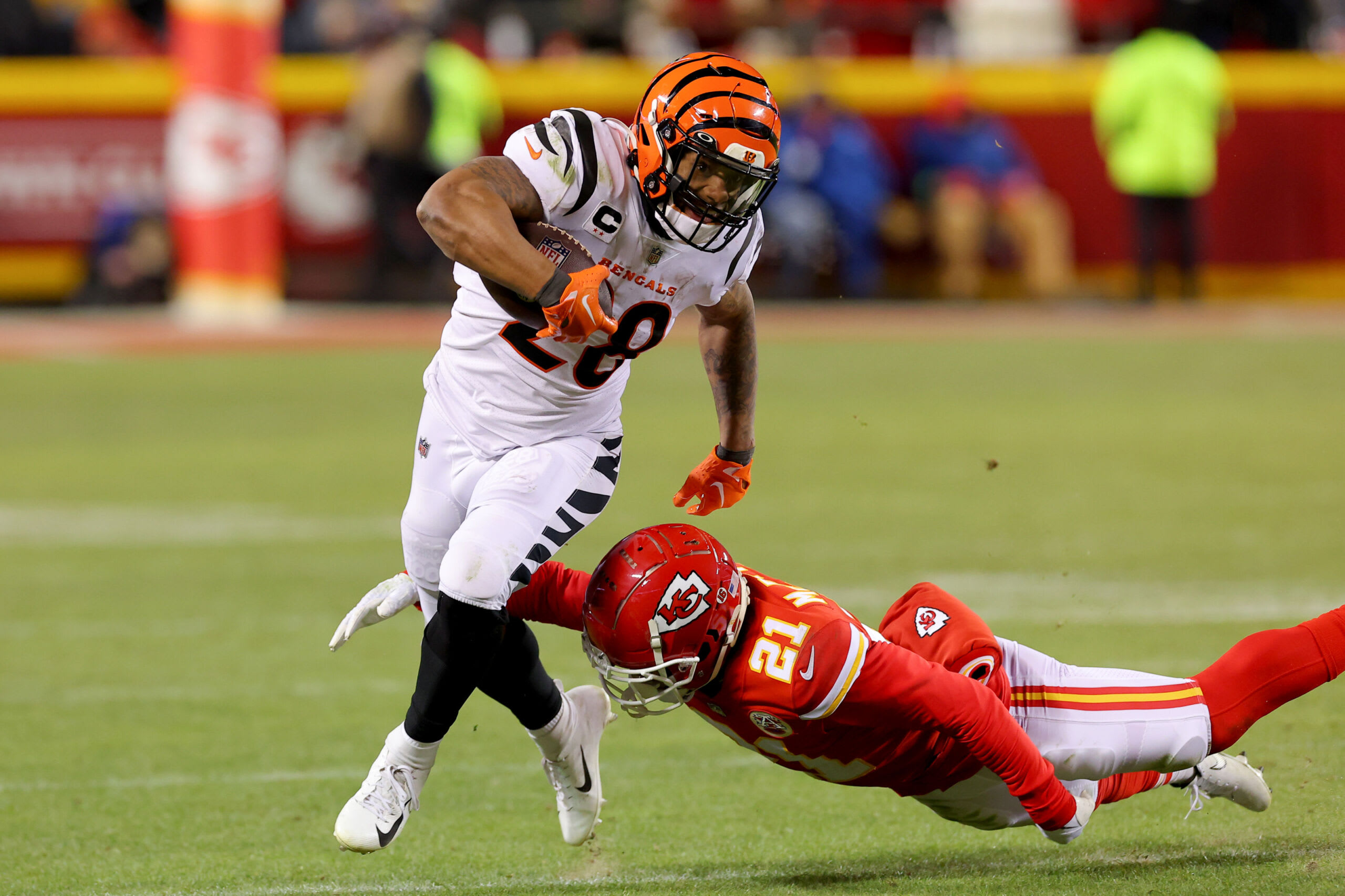 Joe Mixon #28 of the Cincinnati Bengals carries the ball against the Kansas City Chiefs during the third quarter in the AFC Championship Game at GEHA Field at Arrowhead Stadium